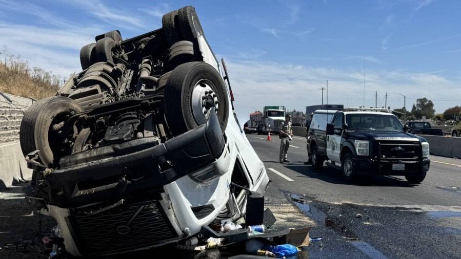 Big rig rolls over onto Hwy 99, 'extreme traffic' expected