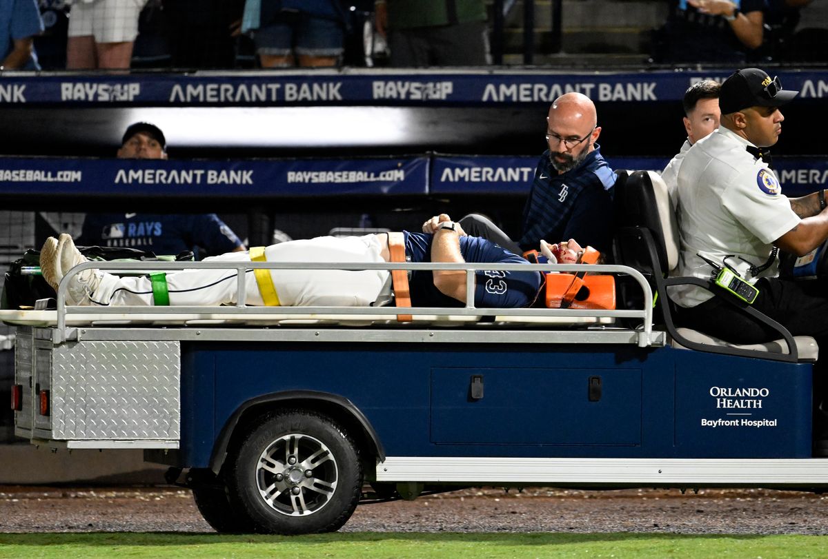 Rays pitcher carted off field after foul ball strikes him in dugout